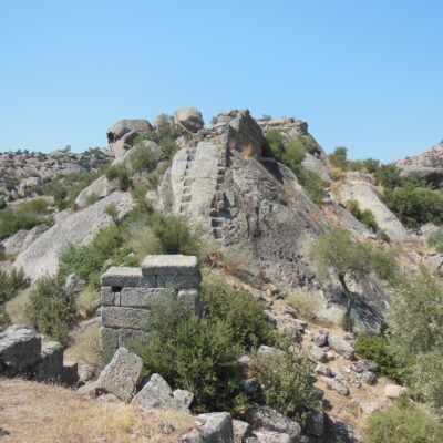 Note the steps cut into the rock to support the walls' foundations