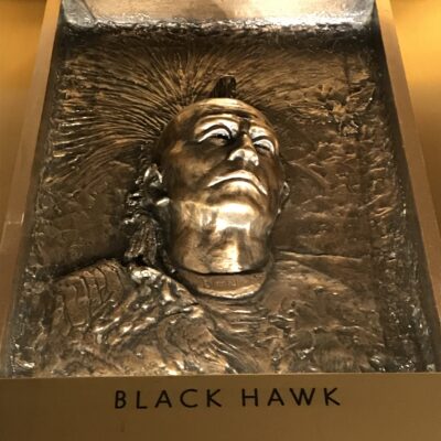 Detail of one of the bronze panels over the elevators. Each panel shows either a voyageur or a prominent Native American - in this case, Chief Black Hawk